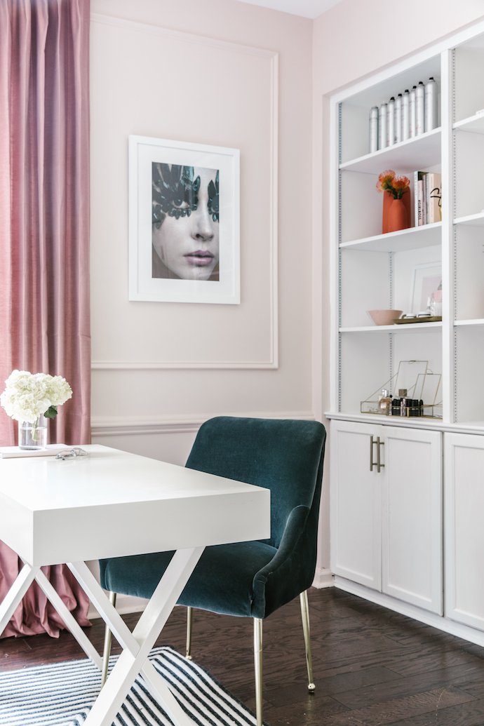 Beautiful Blush Studio with Stlyed Shelves Containing High End Beauty Products, Desk and Velvet Chair