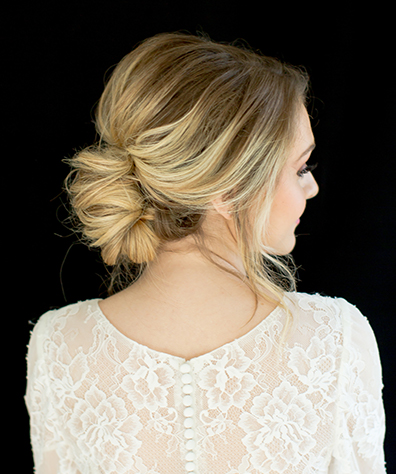 Blonde model with rounded bun and slight bouffant